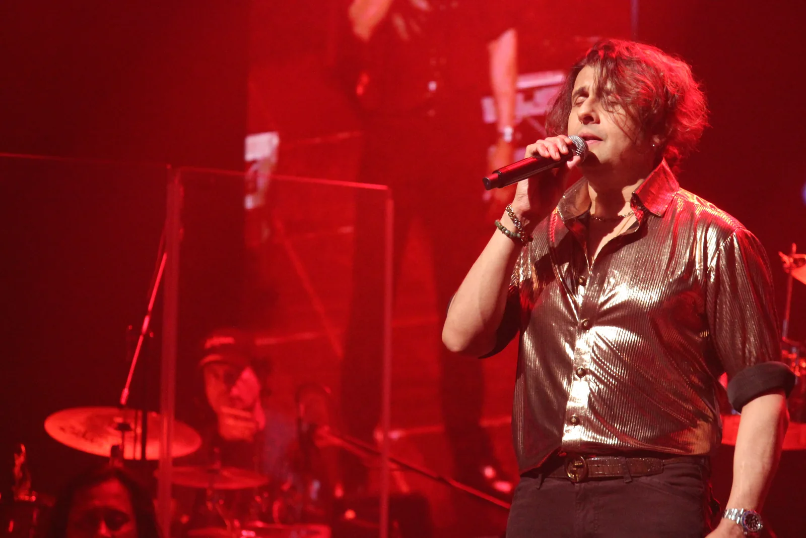 Vocalist under deep red stage light