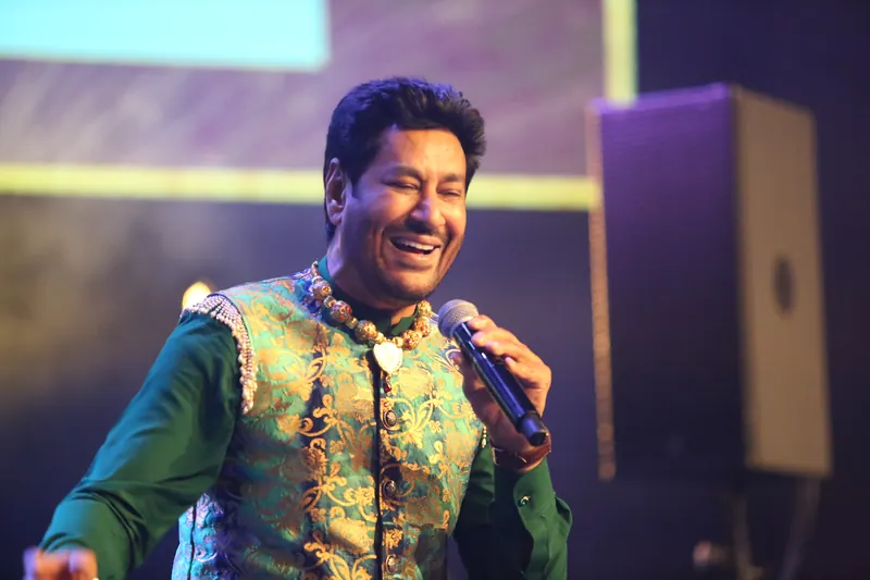 Vocalist laughing mid-performance